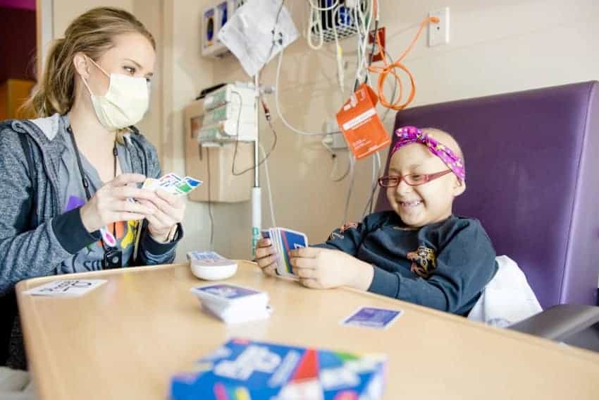 Haley Herdman, a child life specialist at Phoenix Children’s, plays with a patient
