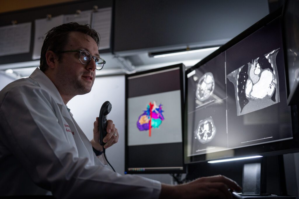 Dr. Simmons looks at the cardiac MRI image of a heart.