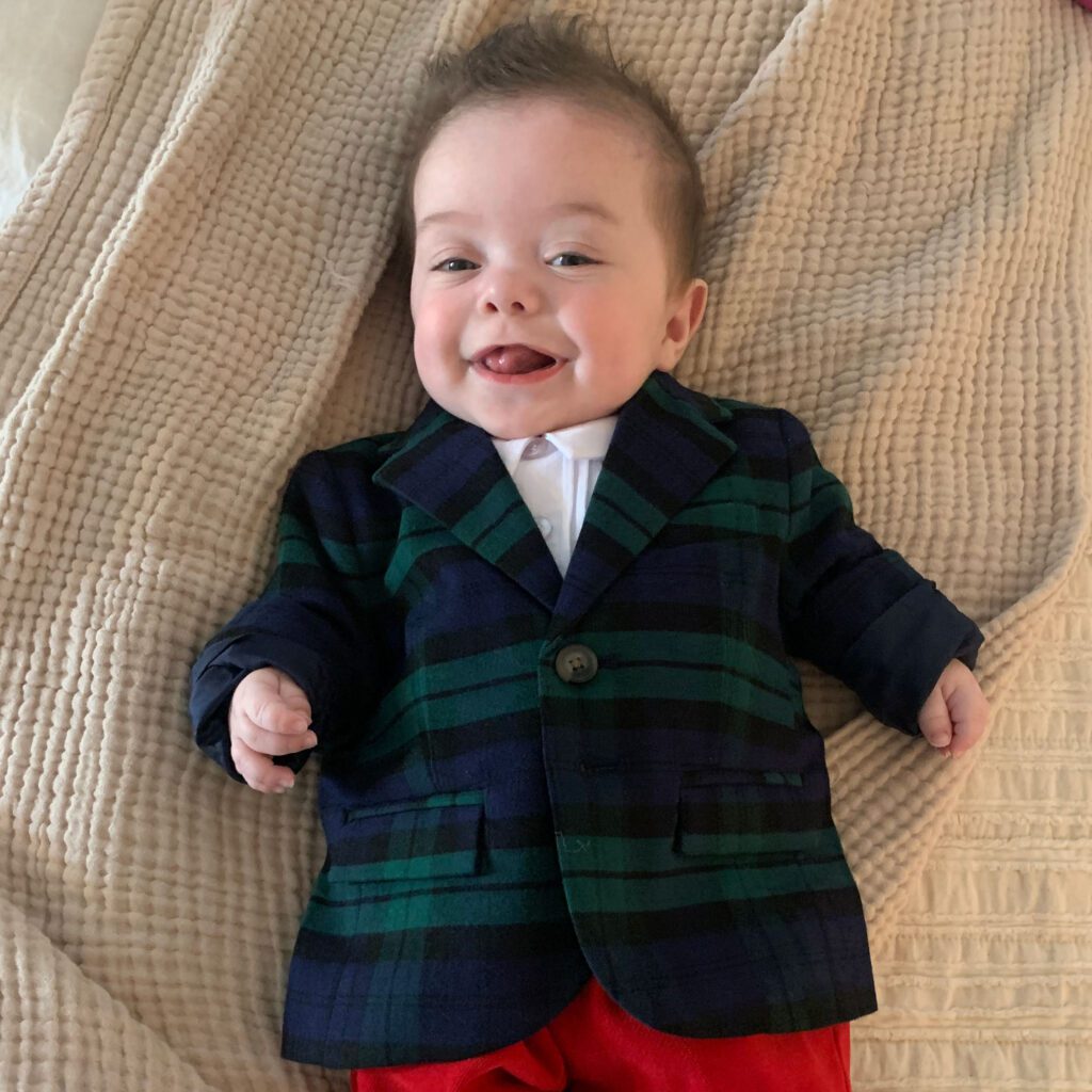 Baby Joey wears a plaid suit
