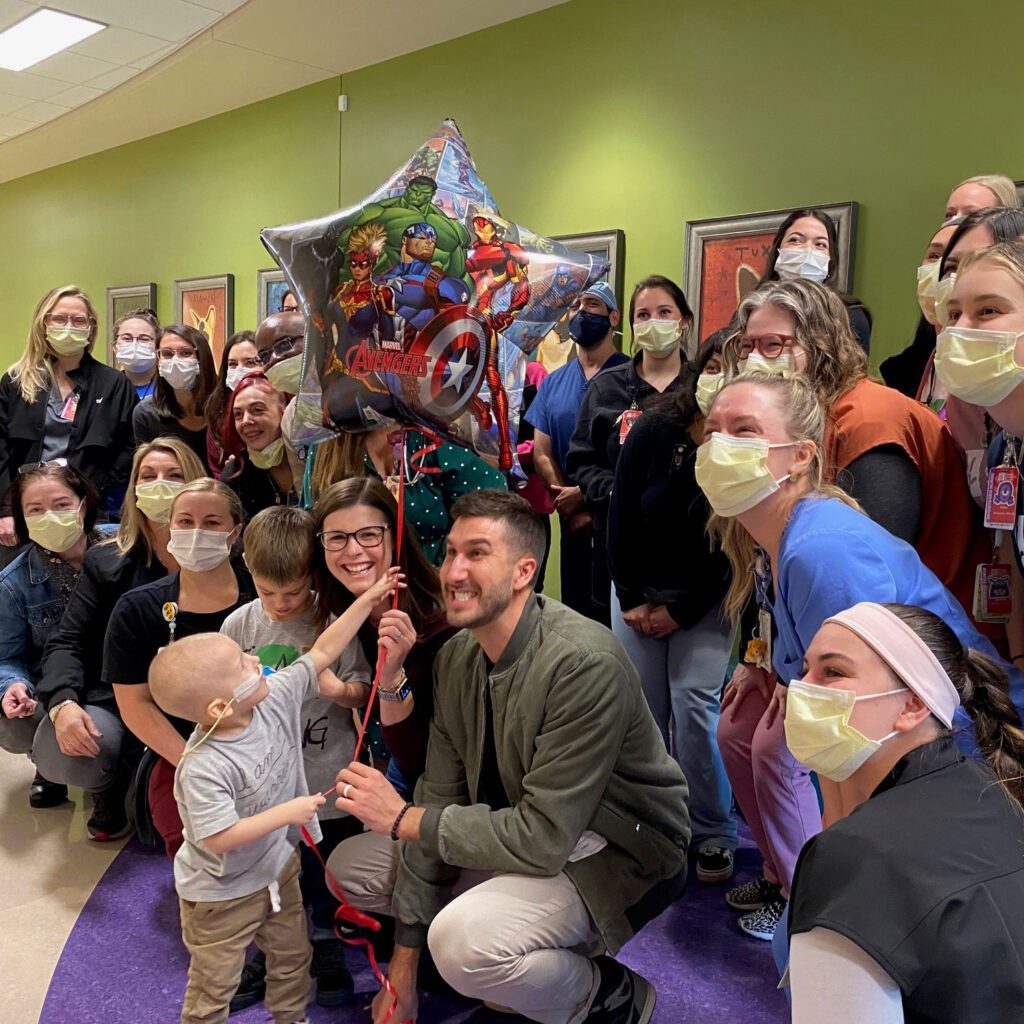 Nash and his family pose with the hospital staff in celebration after he finished his chemo