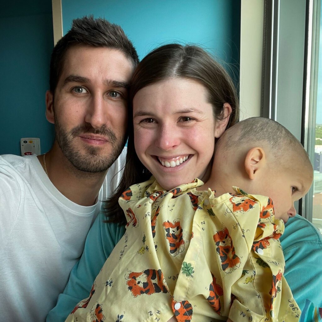 A family photo of Nash and his parents in Nash's hospital room during treatment