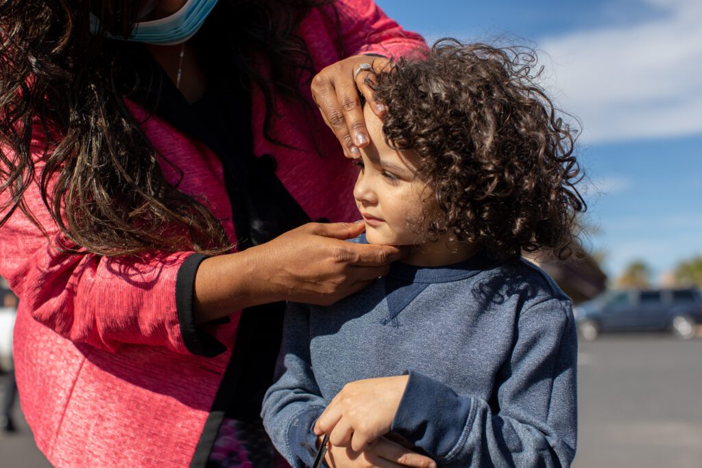 A Phoenix Children's physician checks on the eye health of a homeless child. 