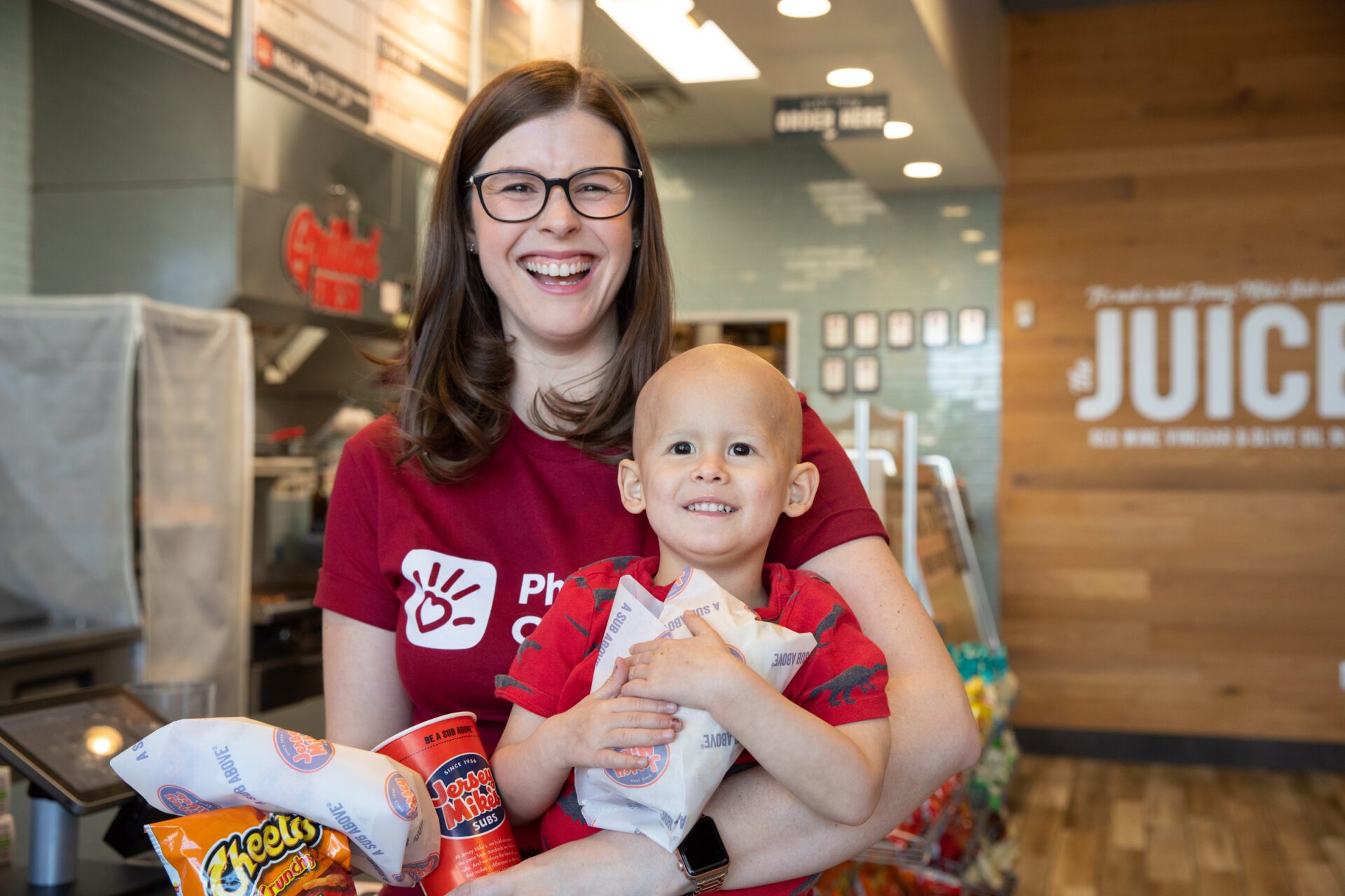 A mom and her little boy who has cancer enjoy a meal together at Jersey Mike's