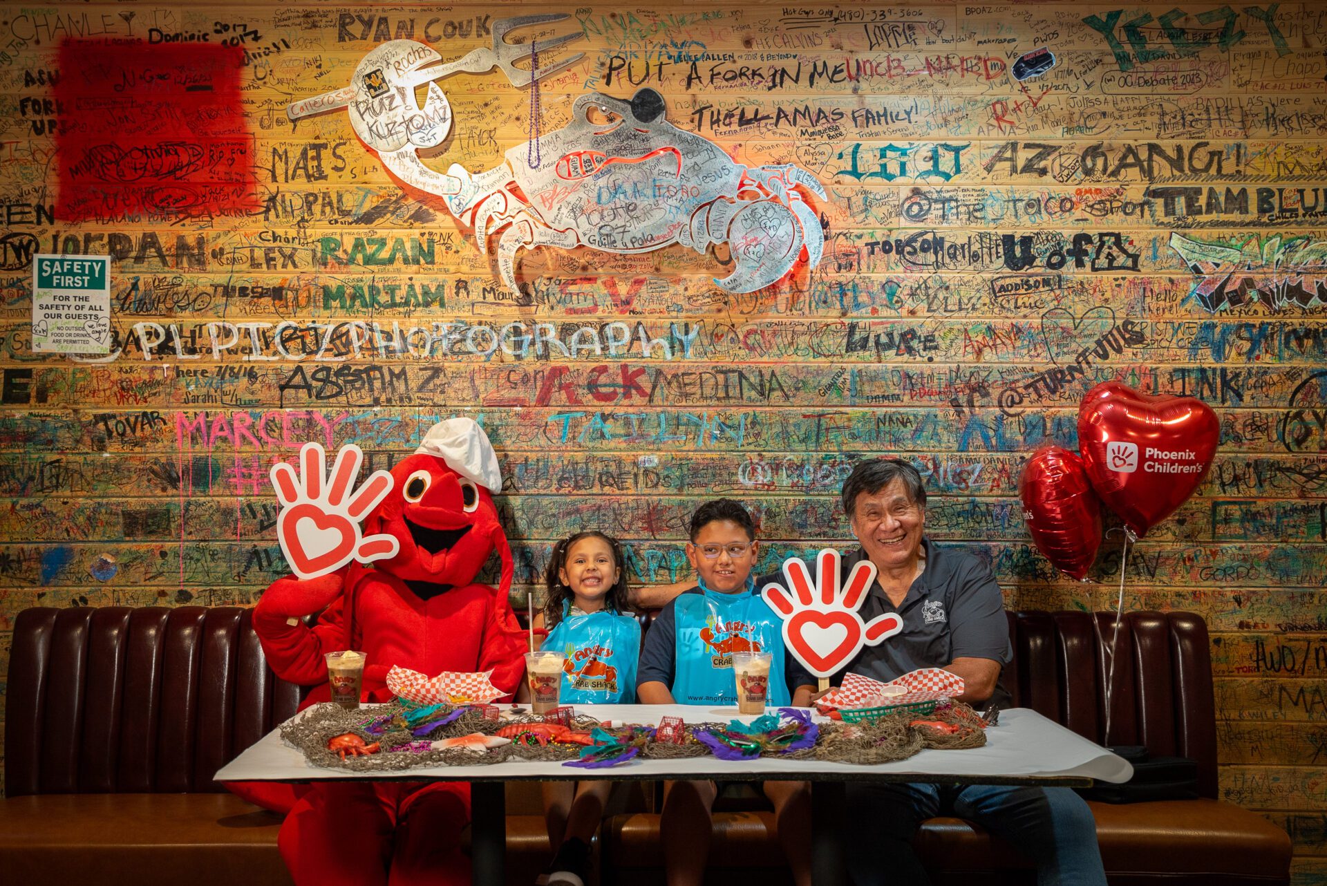 A Phoenix Children's patient and his sister enjoy a meal at Angry Crab Shack