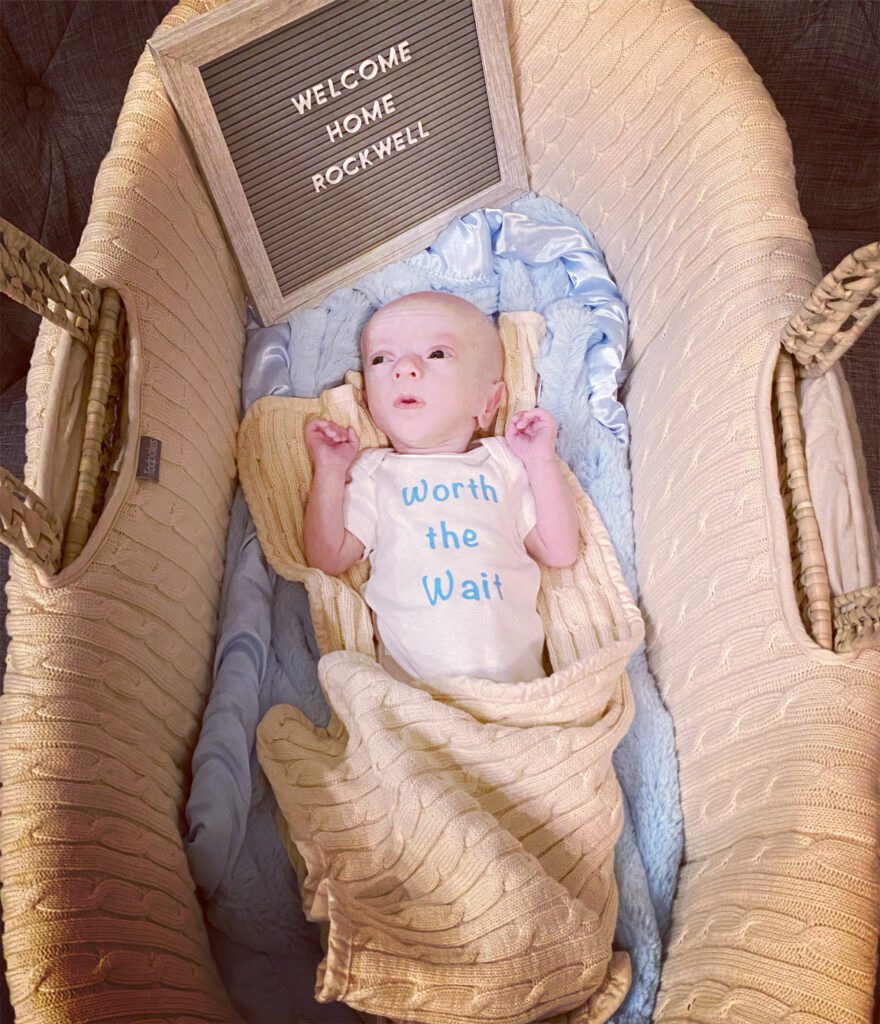 Rockwell lays in a bassinet at one month old