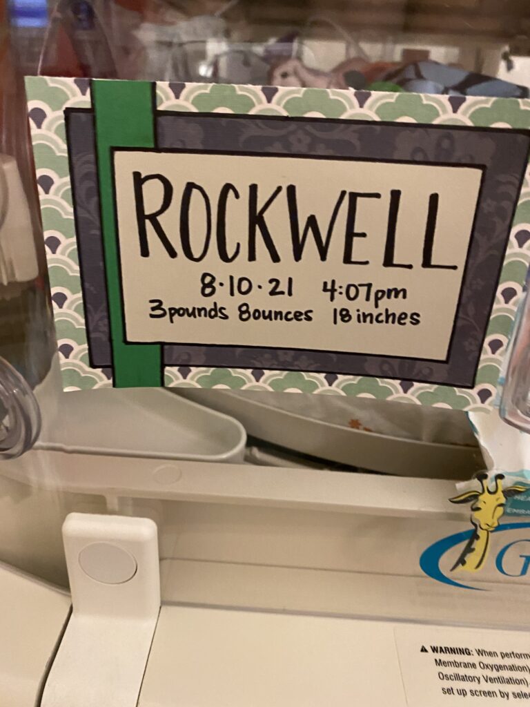 The card that says Rockwell's name in the hospital. It reads his birthday, August 10, 2021 at 4:07 p.m. and his weight of three pounds eight ounces.