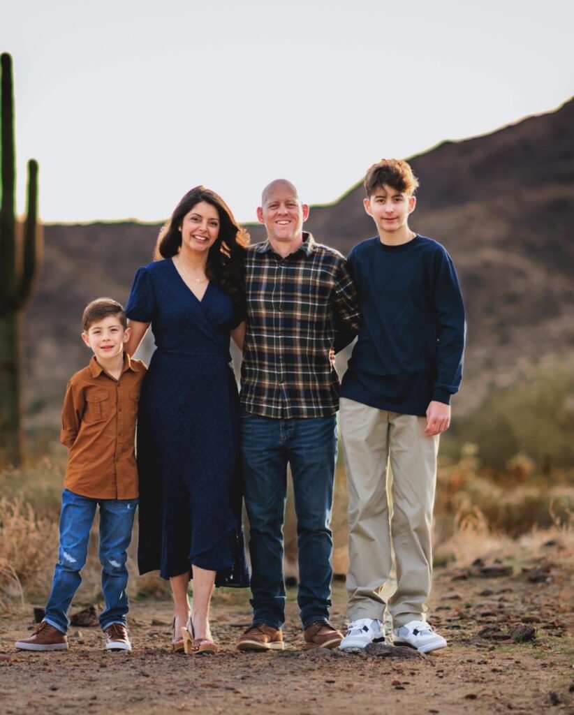 Calvin with his parents and younger brother.