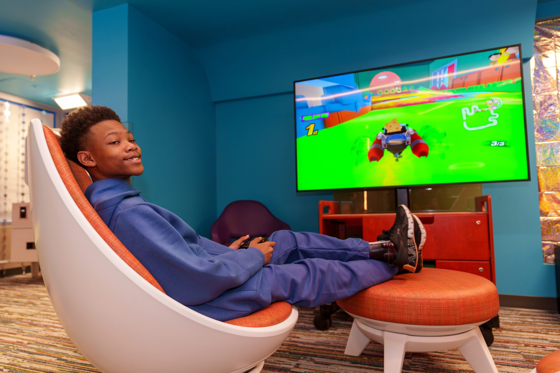 A patient plays video games in The Zone.