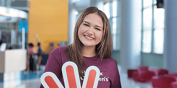 Makayla stands in the Phoenix Children's lobby.