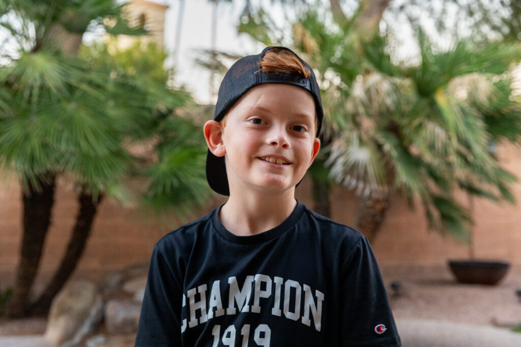Connor, a Phoenix Children's patient, at home in his backyard.
