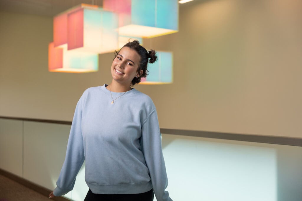 Smiling woman in casual attire.