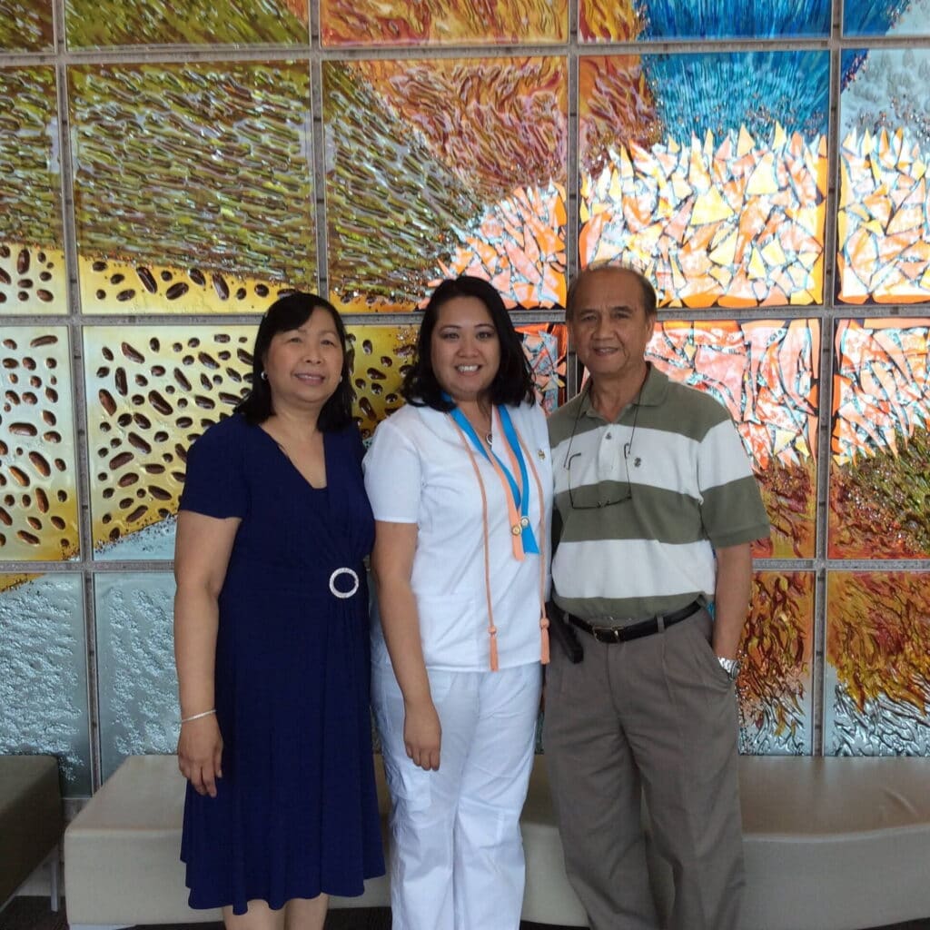 Christie Cabrera with her parents.