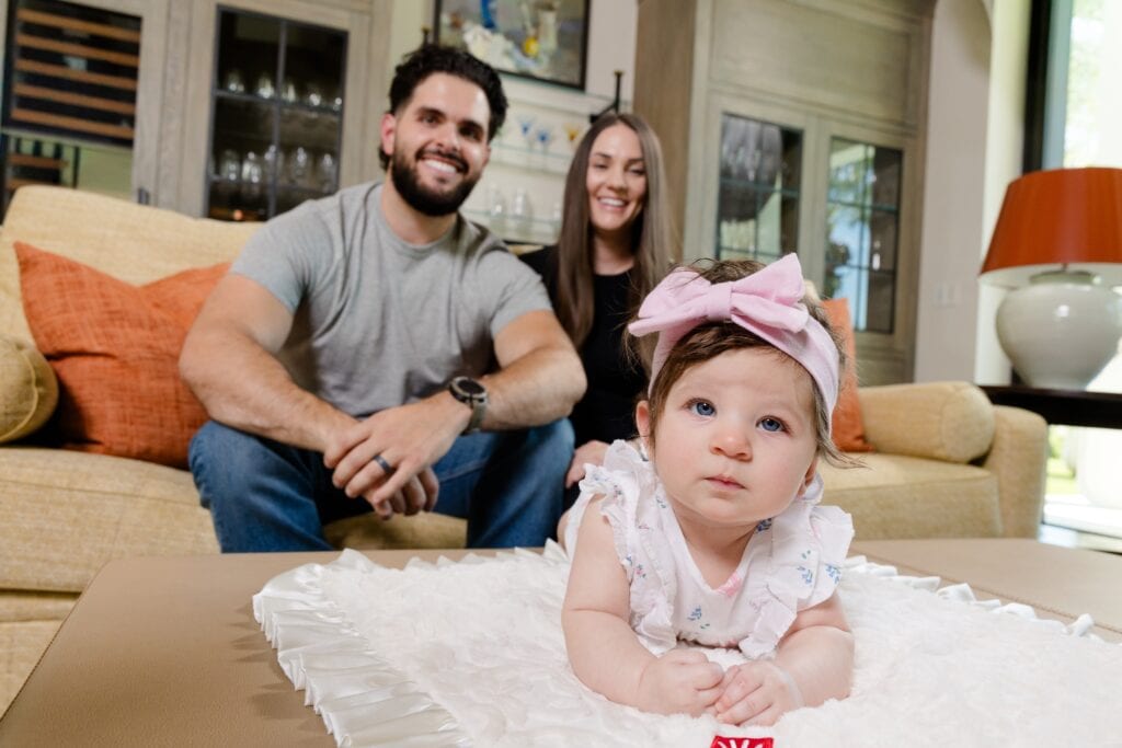 Anthony Ghiz with his wife and baby daughter.