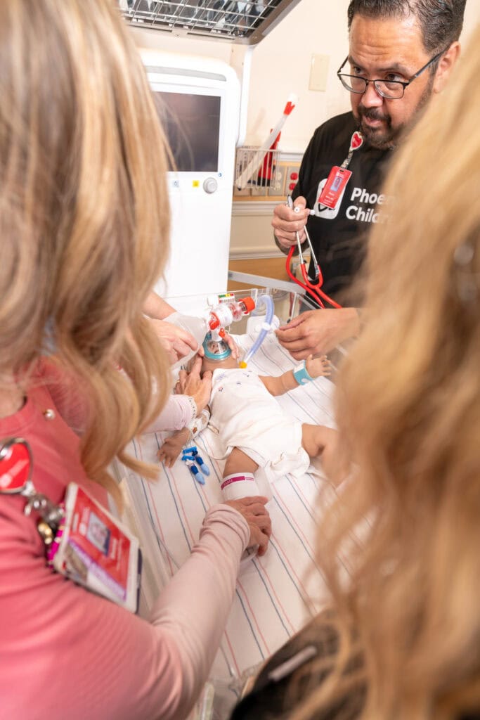 A care team works on a manikin during a simulation.
